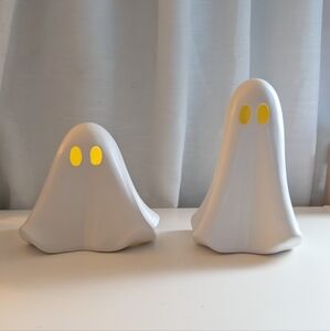 White Ghost Figurines with Yellow Eyes